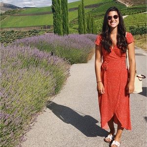 Red polka dot wrap front dress